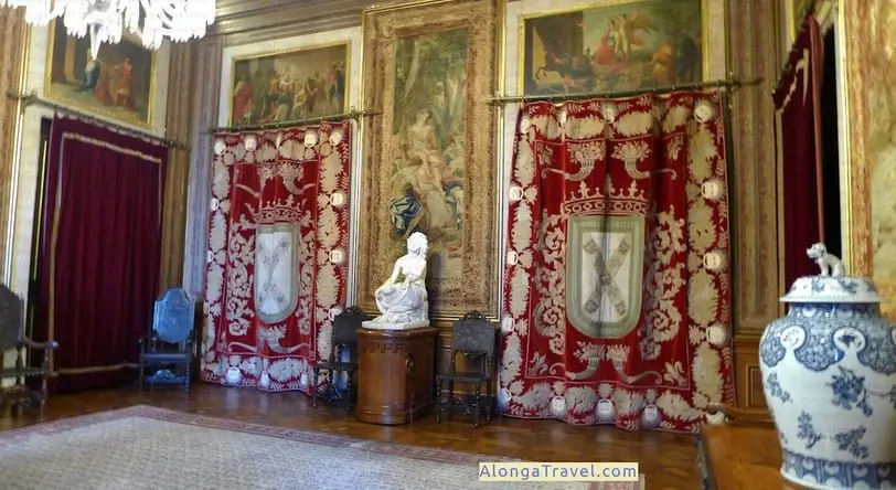 Red Tapestry with Royal Portuguese coats of arm in Ajuda Palace in Lisbon