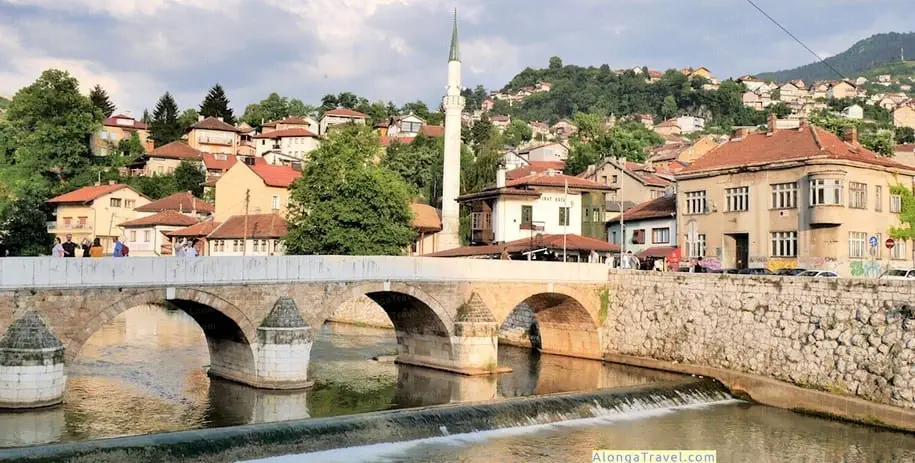 A medieval bridge over the river in Sarajevo - a cheap place to fly into in Europe