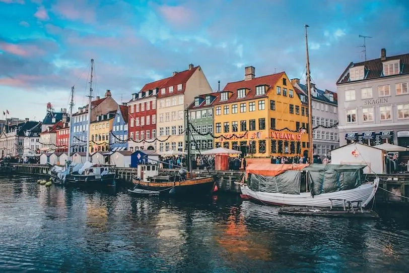 Colorful houses along the River in Copenhagen, the cheapest city in Europe to fly into