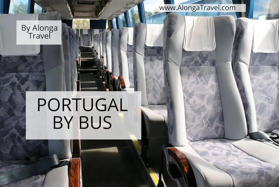 Rows of comfortable looking seats in an empty bus & a custom signs that says 'Portugal by bus'