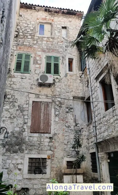 old mediaeval house in Kotor Montenegro old town with broken windows