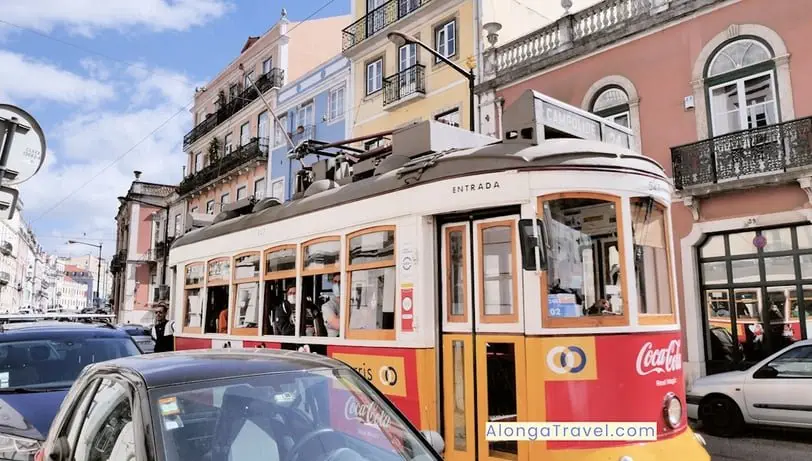 Red tram 28 on the streets of Lisbon, the cheapest place in Europe to fly into
