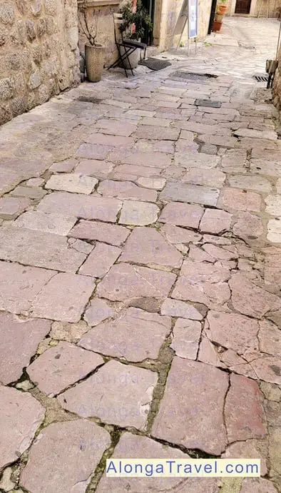 Admire beautiful pink cobblestone pavement The cobblestones you will walk on are uneven and beautiful! So, don't forget to lo