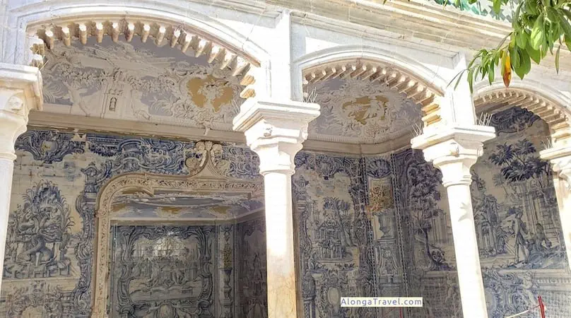 White ornate arches of a grotto in National Palace of Sintra, decorated with blue picture tiles
