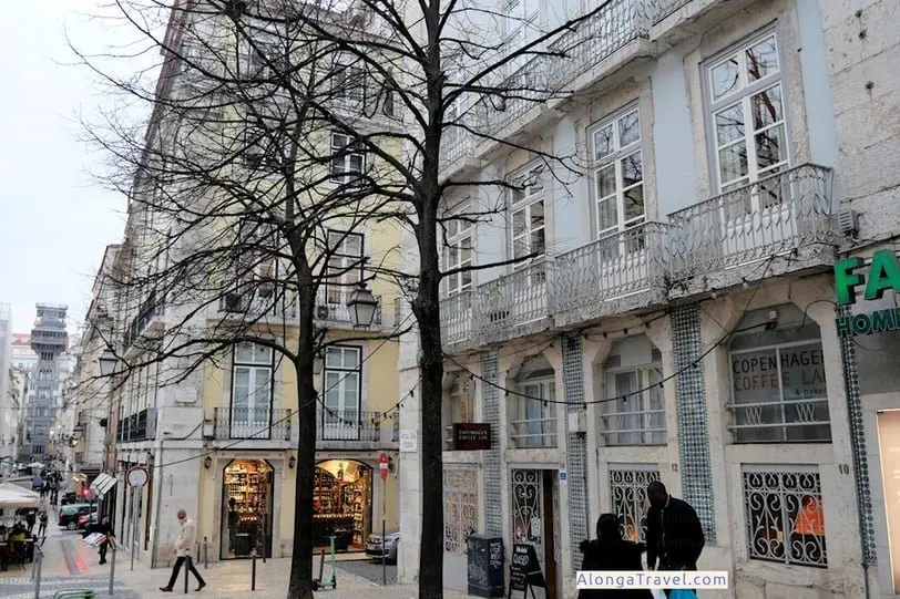 Busy modern grid-like layout streets in Baixa with beautiful balconies on Pombaline style buildings