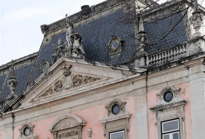 Sculptures and statues decorating pink Pombaline style buildings