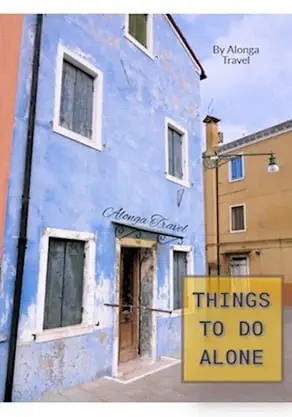 A blue old house in Europe & a custom sign: 'Things to do alone'