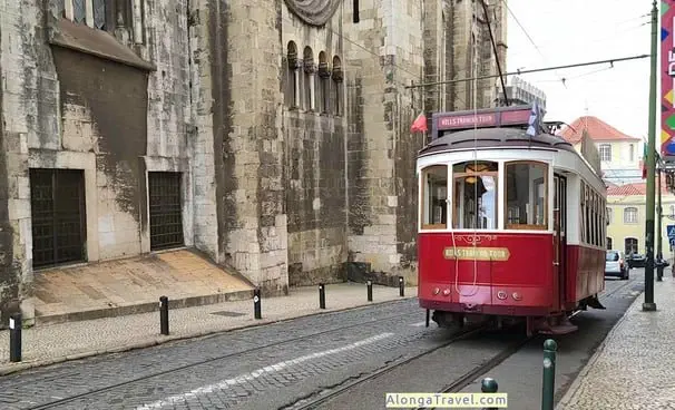 Red Tourist tram 28 wagon in front of Se Cathedral in Lisbon