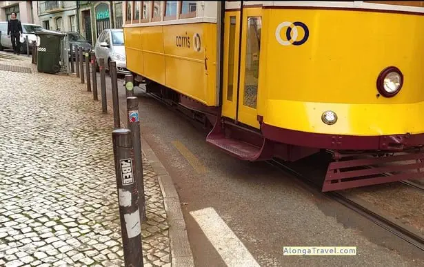 Yellow retro looking wagon on route E28 in Lisbon