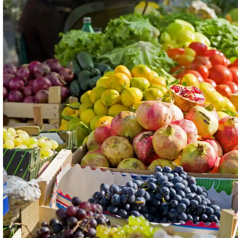 d stall with different fruits and grapes