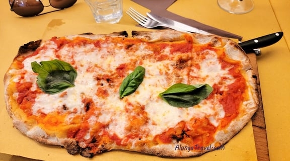 oven baked Margherita pizza on my table in Napoli, Italy