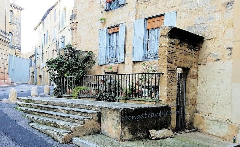 Blue window frames on a house in Montpellier, France - an offbeat destination not to be missed!