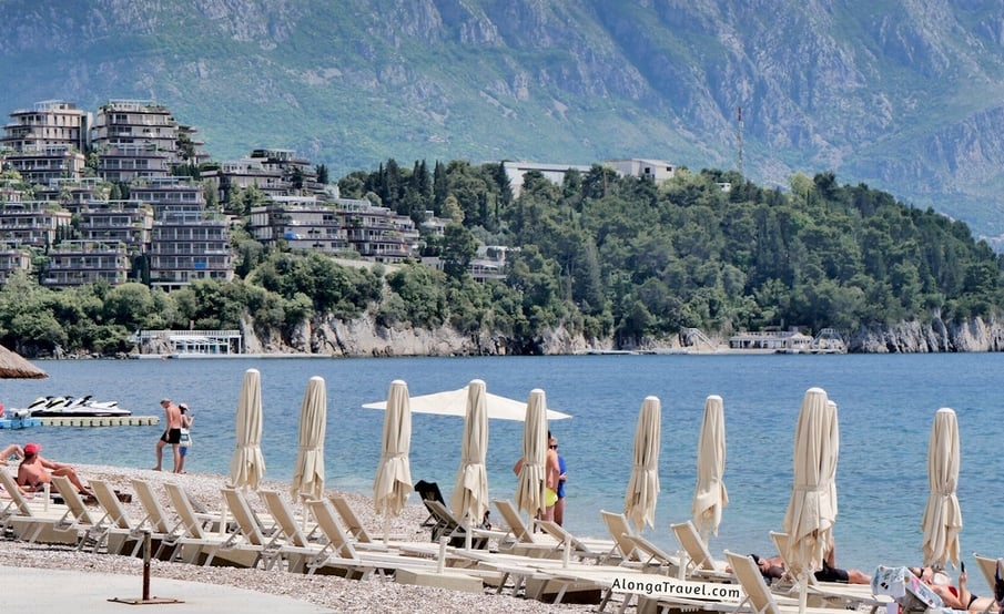 sun umbrellas on a beach in Budva, Montenegro - one of the best summer destination in Europe