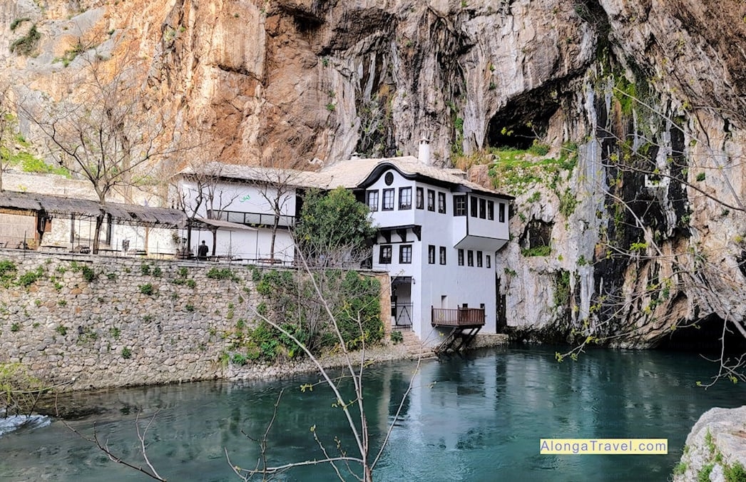 A white house hanging on a cliff