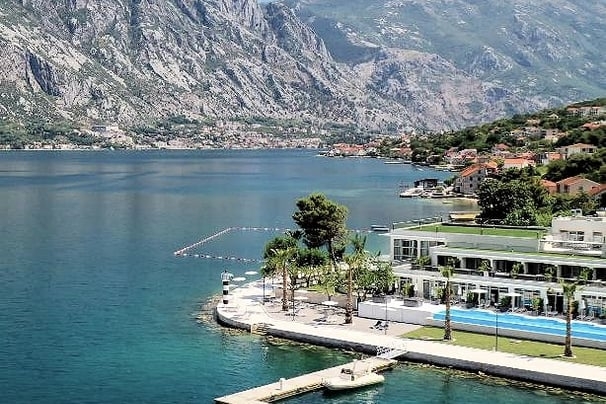 Blue Kotor Bay Premium Spa Resort, surrounded by the turquoise water of Kotor Bay