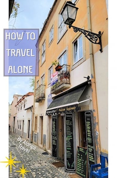 A narrow lane in Portugal & a custom sign: 'How to travel alone'