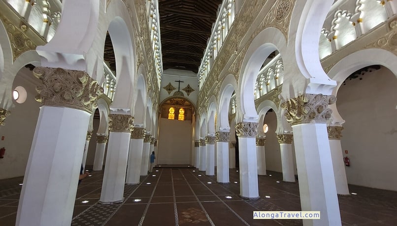 a large room with columns and arches