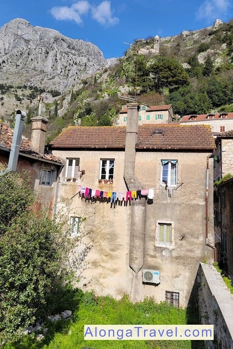 old looking pretty pink house as seen from Kotor lower walls