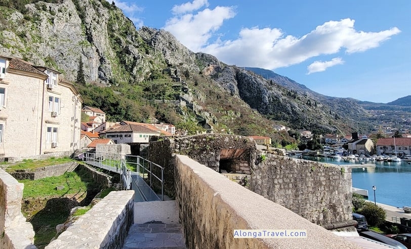 a walkway between 2 bastions in Kotor with amazing views