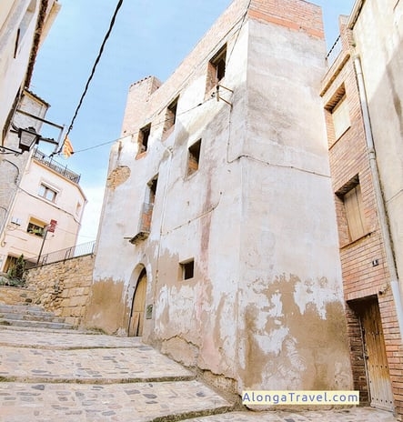 unusually shaped white medieval house in Spain