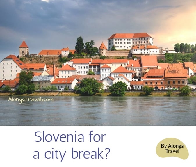 Old castle on the river & a custom sign: 'Slovenia for a city break?'