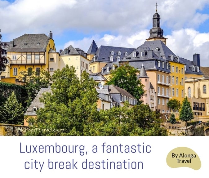 colorful buildings in old town & a sign: 'Luxembourg, a fantastic city break destination'