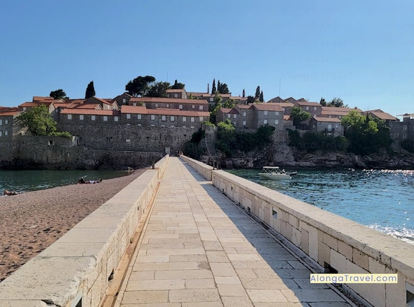 A road leading to Sveti Stefan island, surrounded by beautiful beaches